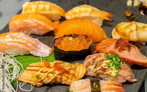 Sushi set japanese food,Hotate (Scallop), shrimp,eel (Unagi),salmon burn,Ikura (Salmon egg), Foie gras.