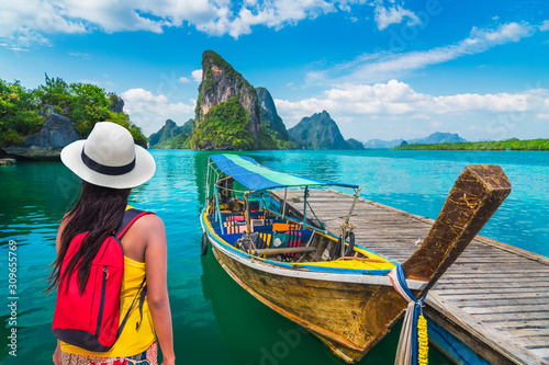 Traveler woman looking beautiful destinations place, Boat for tourist on Phang-Nga bay view Panyee island scenic nature landscape, Travel adventure Phuket Thailand, Tourism Asia holidays vacation trip © day2505