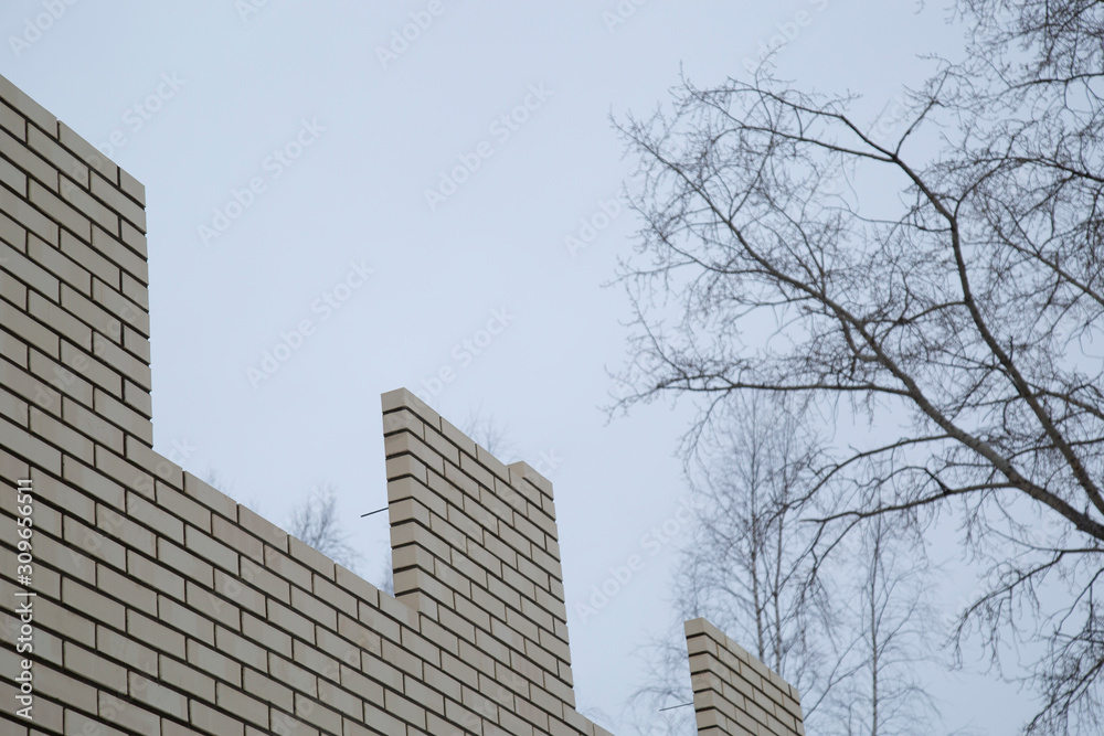 Obraz premium Laying bricks. Making a brick wall.Construction of a brick house.