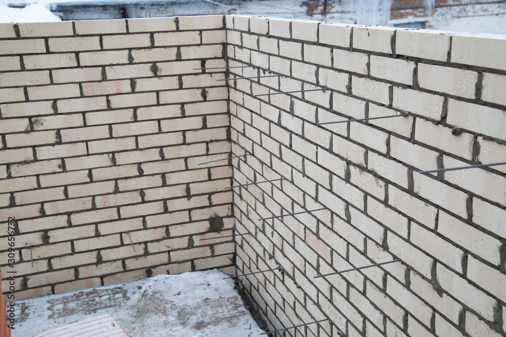 Laying bricks. Making a brick wall.Construction of a brick house. Laying bricks. Making a brick wall.Construction of a brick house.