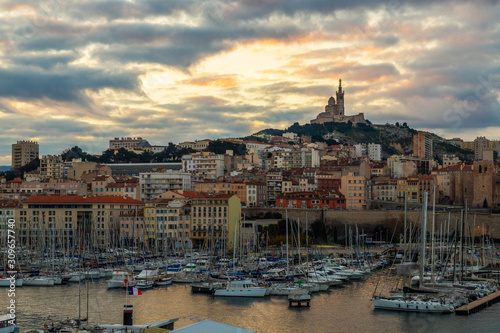 Marseille Old Port, France with Our Lady of the Guard (Notre-Dame de la Garde) church on the hill and old port
