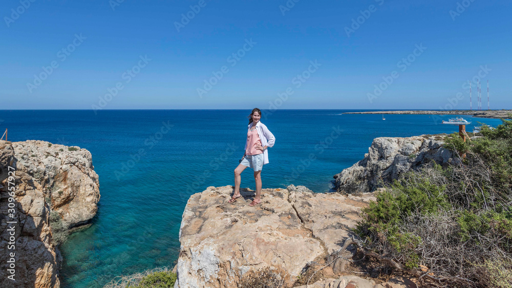 beautiful happy joyful girl near cape greco, ayia napa, cyprus