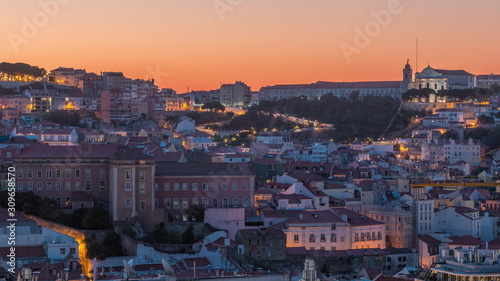 Lisbon aerial cityscape skyline night to day timelapse from viewpoint of St. Peter of Alcantara, Portugal
