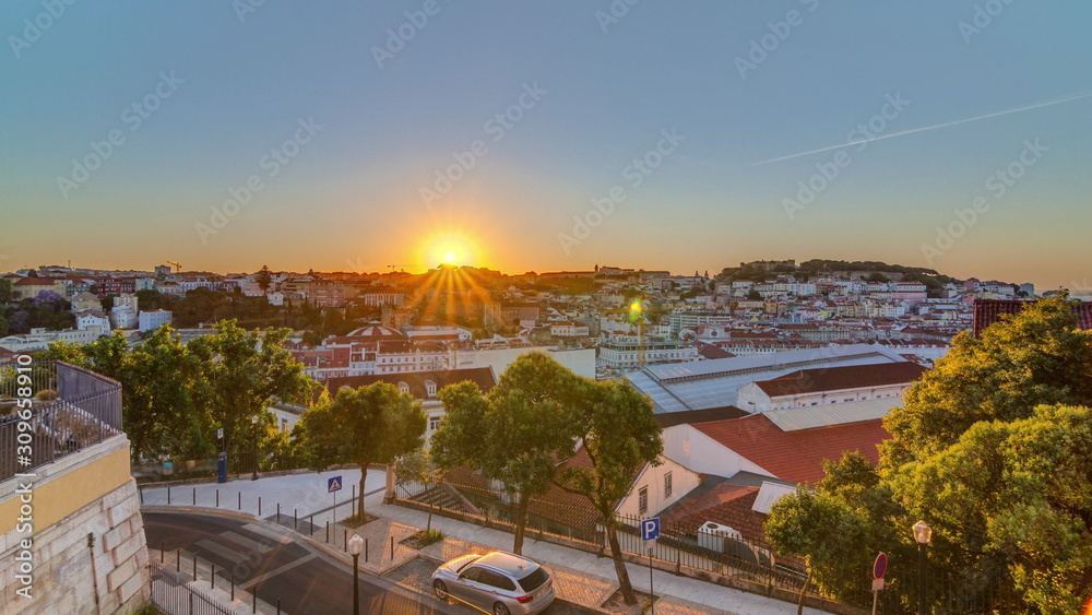 Obraz premium Sunrise over Lisbon aerial cityscape skyline timelapse from viewpoint of St. Peter of Alcantara, Portugal.