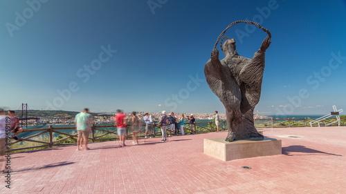 Statue of Virgin Mary timelapse hyperlapse in front of the Sanctuary of Christ the King. Lisbon. Portugal