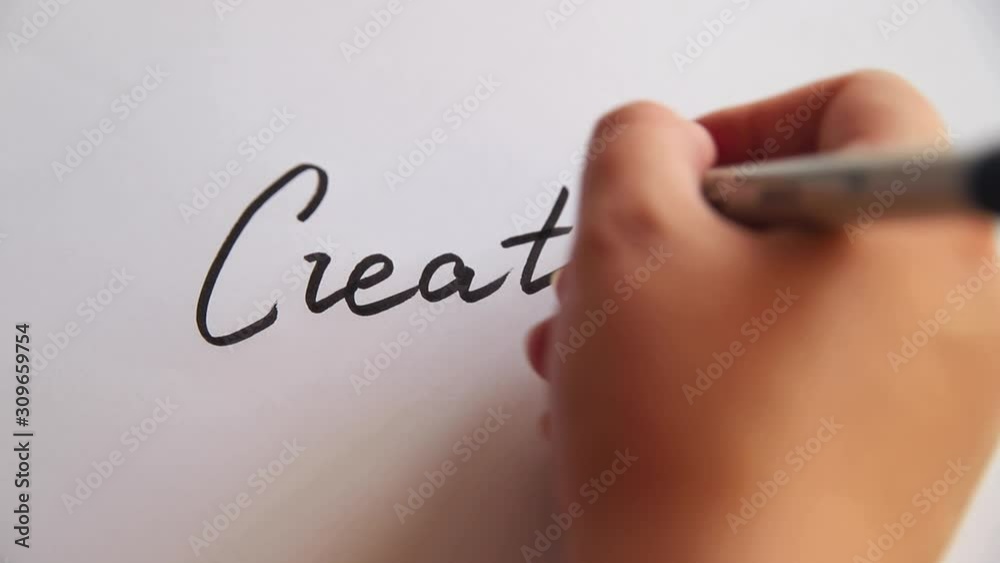 Hand writing Creative on white paper Hand writing Creative on white paper