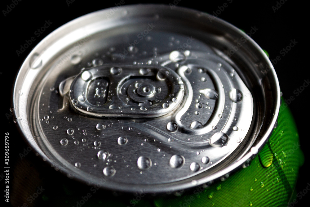 aluminum soda and beer beverage can with water droplets isolated on dark background, metal can, recyclable product aluminum soda and beer beverage can with water droplets isolated on dark background, metal can, recyclable product