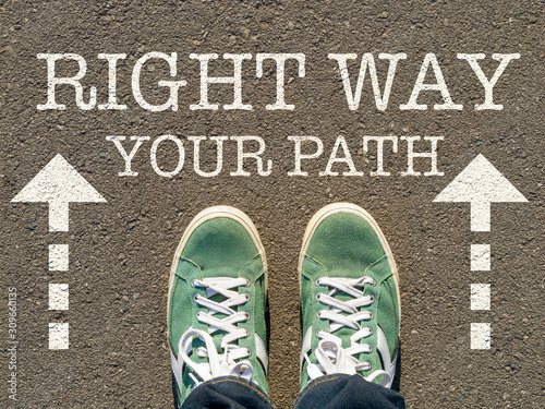 photo on top of the sneakers and the inscription right way on the asphalt, the concept of free choice, direction of movement, the philosophical question of life