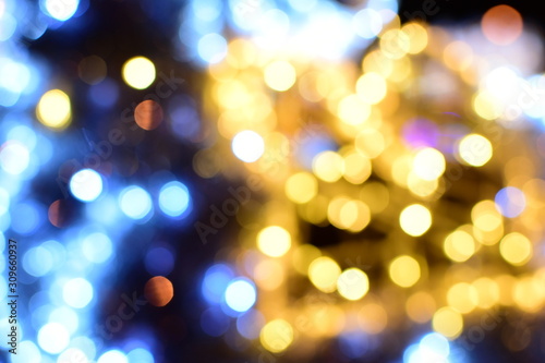 Blurry Christmas lights of the night city. Copy Space.