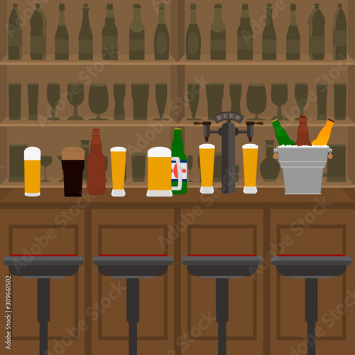 Interior of pub, cafe or bar with counter, glasses of beer, beer pump and ice pail. Inside drinking establishment.  Bar counter, chairs and shelves with alcohol bottles on background. 
