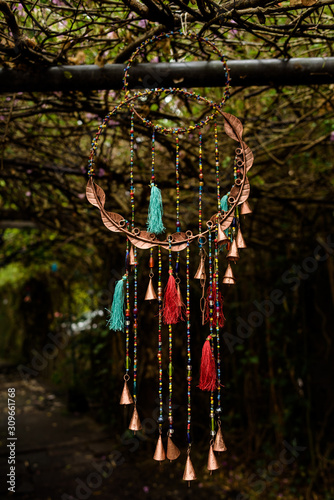 Colorful dream catcher as decoration on dark background