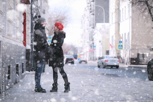 Young couple walking through the winter