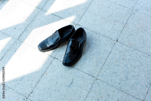 Groom black elegant shoes. Male elegance dress shoes. Wedding groom leather black lacquered shoes. Wedding concept.