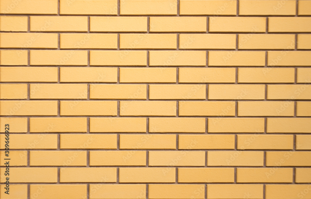 brick wall of new yellow bricks brick wall of new yellow bricks