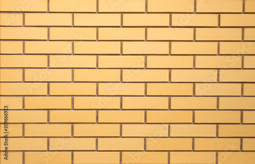  brick wall of new yellow bricks