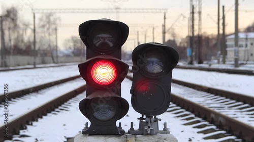 Traffic light shows red signal on railway. Red light