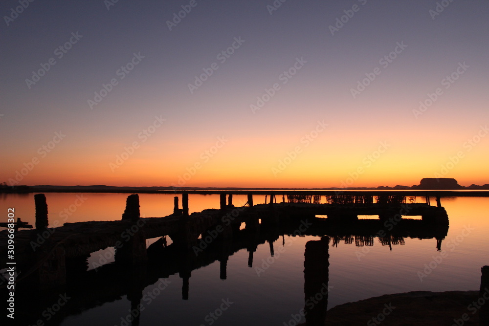 Siwa sunset over bridge at Fatnas island
