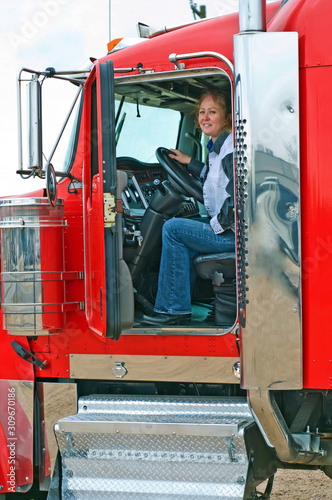 Interior View Of Big Rig With Woman Truck Driver