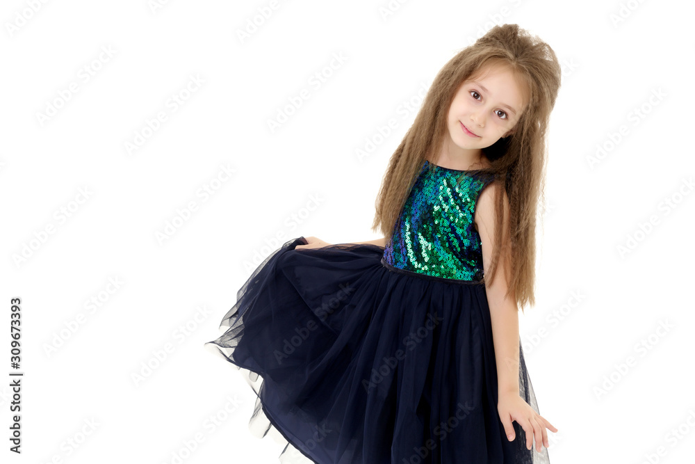 Little girl in an elegant dress.