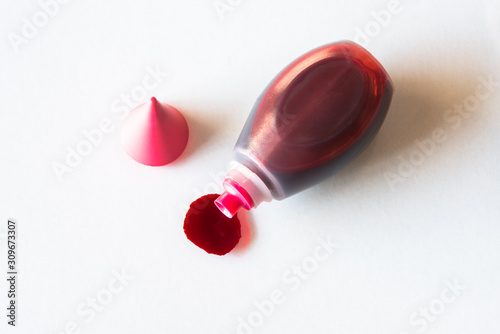 Red Food Coloring Spilled From the Bottle