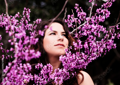 Outdoor Portrait Of Young Caucasian Woman Amid Spring Blossoms