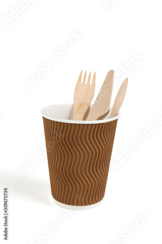 Eco - friendly fork, spoon, knife and cup isolated on white background . Disposable tableware.
