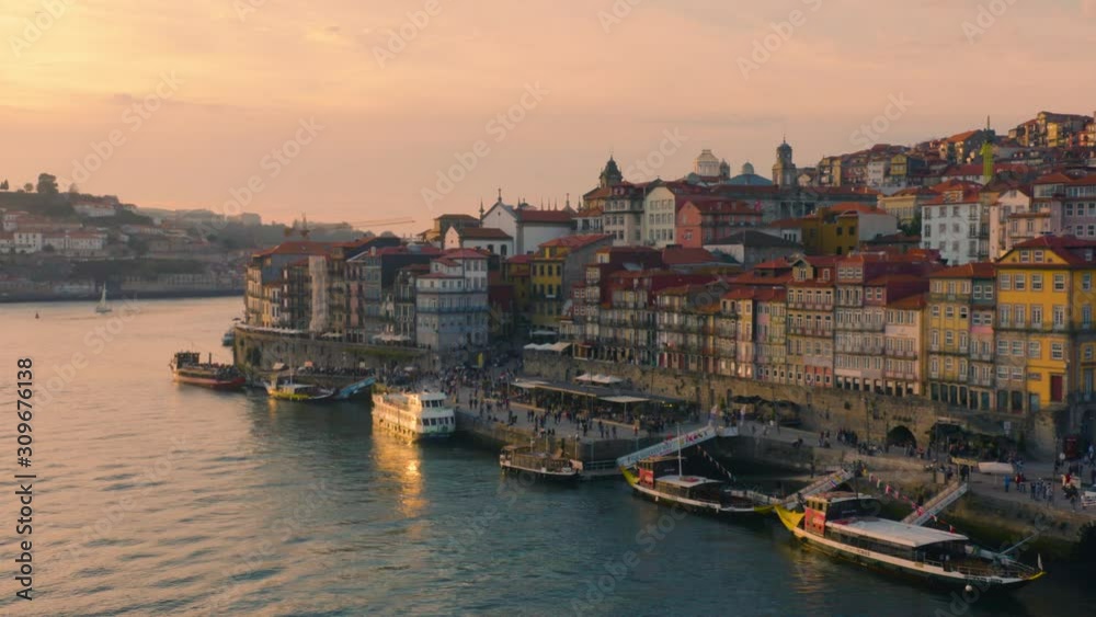 Porto, Portugal. Aerial view of the old city with promenade of the Douro river at sunset Porto, Portugal. Aerial view of the old city with promenade of the Douro river at sunset