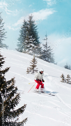 Female freeride skier. Winter active sport