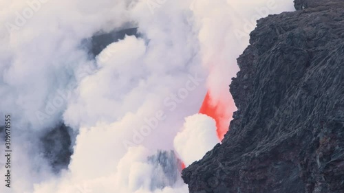 Lava from the Kīlauea volcano flows into the ocean on the Big Island of Hawaii photo