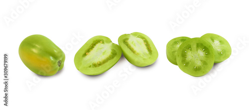 Green unripe tomato, whole, halves and slices isolated on white background side view