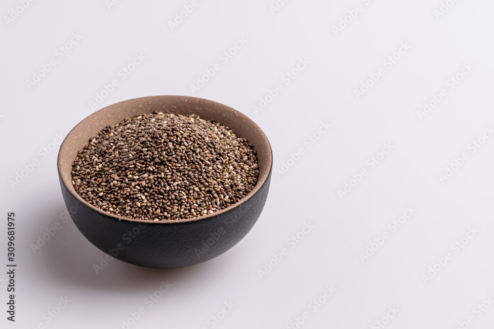 Chia seeds isolated on white background, angle view, copy space, studio shot, soft light. Latin name (Salvia hispanica). Chia seeds isolated on white background, angle view, copy space, studio shot, soft light. Latin name (Salvia hispanica).