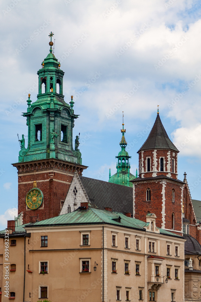 Wawel Castle in Krakow (Poland) against the blue sky with white clouds