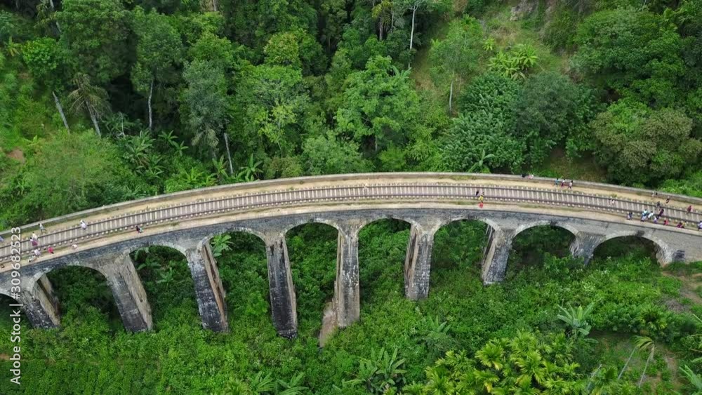 Aerial view of Nine Arches Bridge with ceylon tea plantation landscape, Famous tourist attraction in Ella, Sri Lanka. Travel South Asia. 4K Drone Video Aerial view of Nine Arches Bridge with ceylon tea plantation landscape, Famous tourist attraction in Ella, Sri Lanka. Travel South Asia. 4K Drone Video