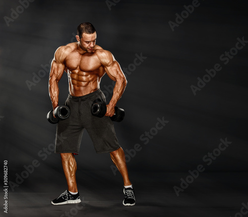 Strong Muscular Men Exercise With Weights