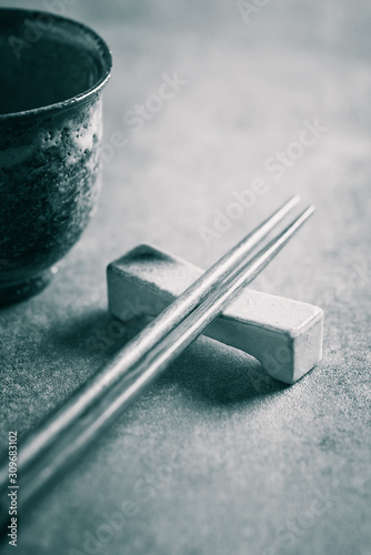 Fototapeta Naklejka Na Ścianę i Meble -  Wooden chopsticks and chopsticks rest. Close up.	