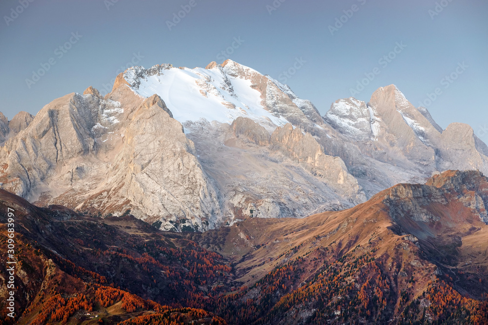 Colorful sunrise over Marmolada Peak - 3343meters, the highest mountain in the Dolomites, Italy