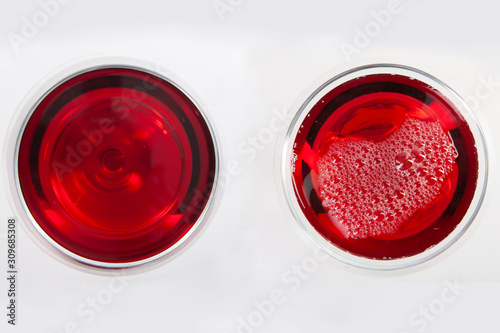 Glass of red wine with shadow.Top view. Abstract red wine bubbles.