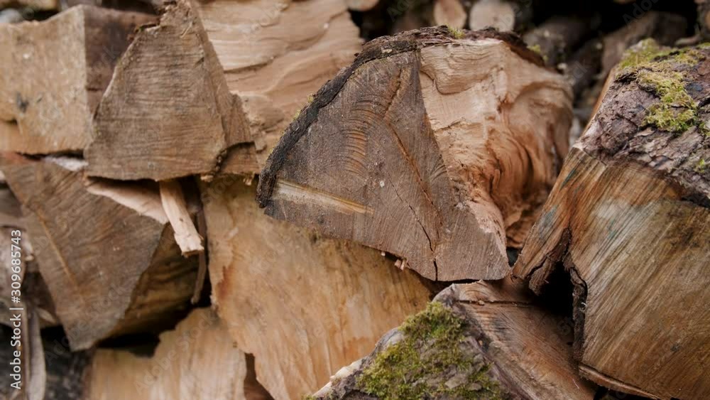 Tight shot of a neatly stacked pile of split wood. Tight shot of a neatly stacked pile of split wood.