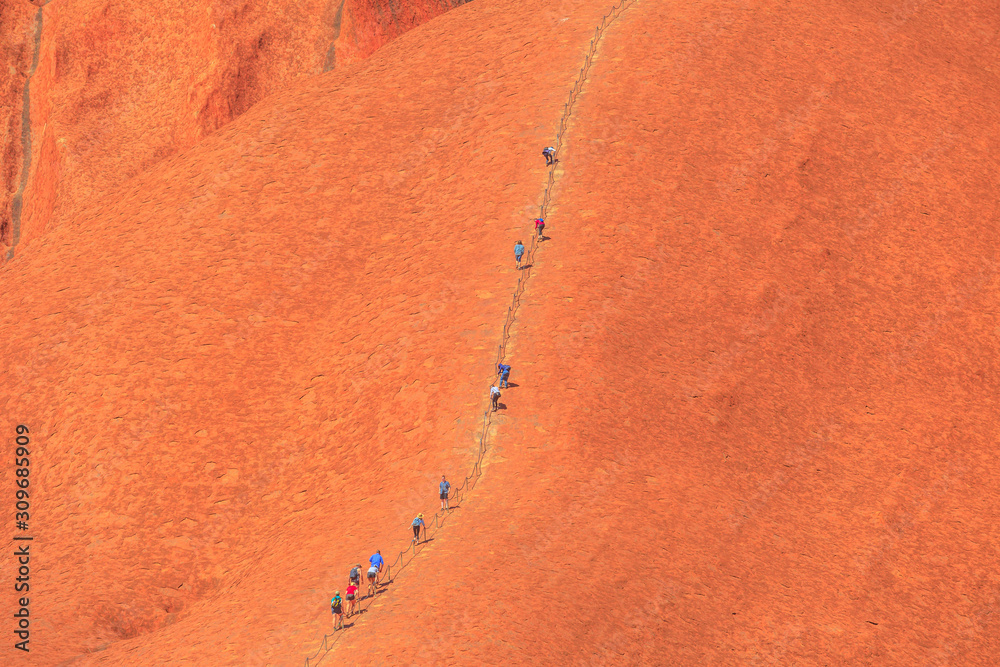 Uluru, Northern Territory, Australia Aug 26, 2019 people climb on