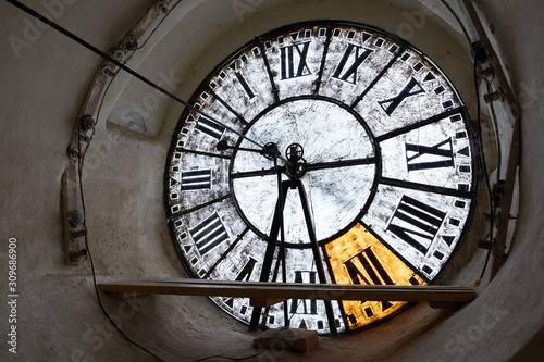 Large clock-face of old mechanical clocks on a tower in a church, inside view