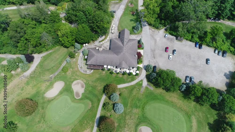 Left To Right Pan Over Golf Clubhouse With Golf Greens By Forest Left To Right Pan Over Golf Clubhouse With Golf Greens By Forest