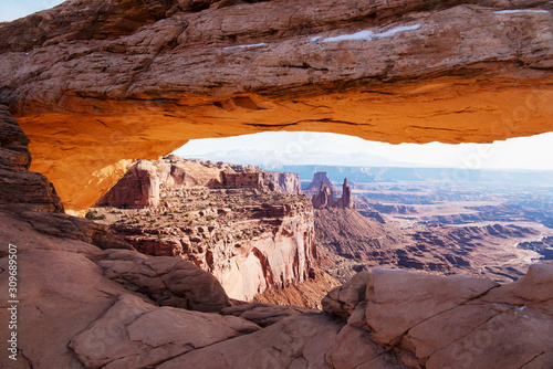 View through the glowing Mesa Arch towards the Washerwoman Arch in the center and the La Sal mountains in the distance © Ralf Broskvar