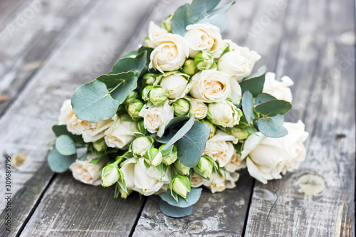 Bride's wedding bouquet on a wooden table