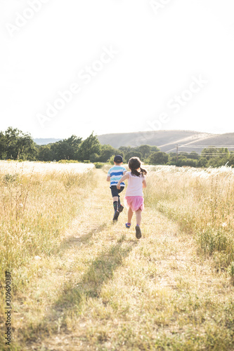 Kids running on a path in the grass © Jordan