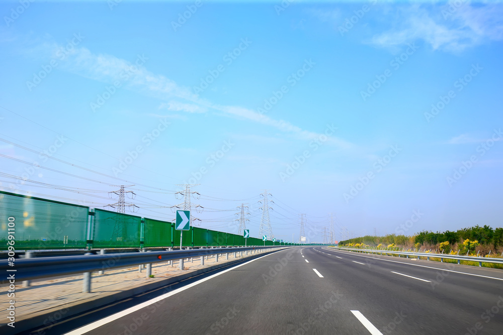 Fototapeta premium Beautiful highway, under the blue sky and white clouds