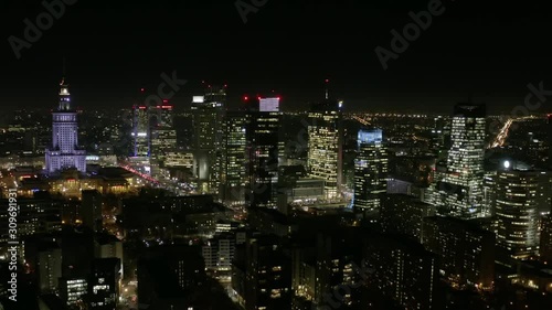Wallpaper Mural Aerial view of the night city with skyscrapers and busy streets with traffic jams during rush hour. Warsaw, Poland. 13. December. 2019. Drone shot at night metropolis with skyscrapers and buildings. Torontodigital.ca