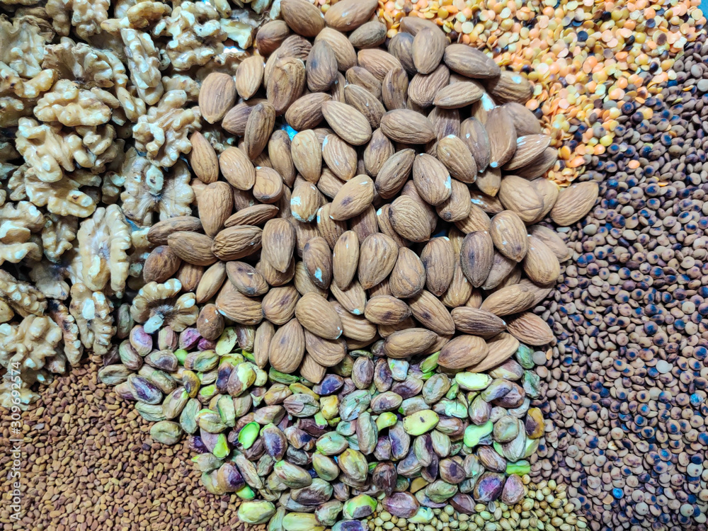 Fototapeta premium A mix of organic nuts and seeds - healthy diet - home cooking - vegan and vegetarian