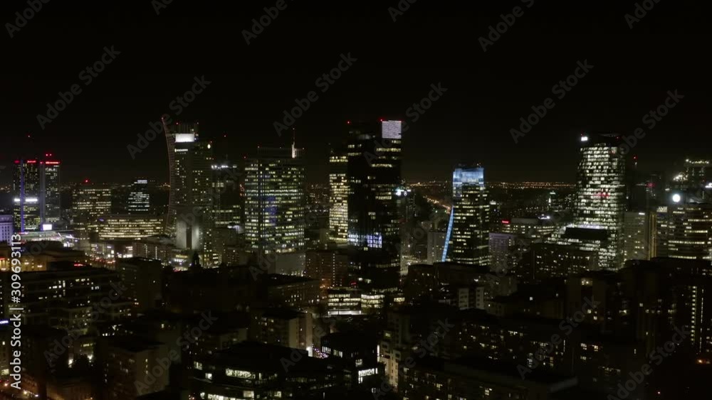 Warsaw Poland. 04. December. 2019. Aerial view of busy streets in downtown Warsaw in City, with bright night lighting. View of the night skyscrapers and streets in the business center of the city. Warsaw Poland. 04. December. 2019. Aerial view of busy streets in downtown Warsaw in City, with bright night lighting. View of the night skyscrapers and streets in the business center of the city.