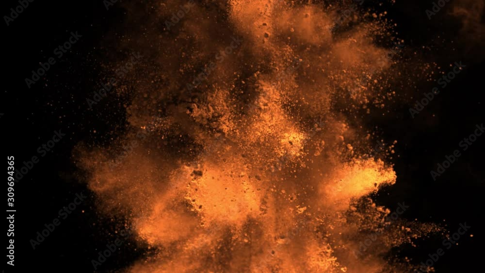Super Slowmotion Shot of Orange Powder Explosion Isolated on Black Background at 1000fps. Super Slowmotion Shot of Orange Powder Explosion Isolated on Black Background at 1000fps.