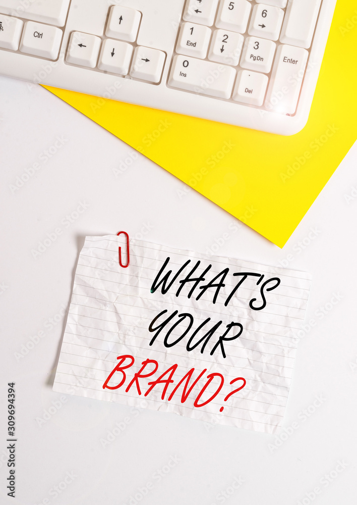 Text sign showing What S Your Brand Question. Business photo showcasing asking about product logo does or what you communicate Flat lay above white blank paper with copy space for text messages